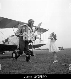 HOME IS THE HOUSEWIFE PILOT    A housewife with a hobby that keeps her '' up in the air '' a good deal of the time is Mrs. 'Jackie ' Moggridge of Taunton, Somerset, who is the West country  only W.A.A.F.V.R.pilot.  Married (her husband was R.E.captain in World War II), and the mother of a three-year-old girl, Jill, Mrs Moggridge runs her home, does all the housework and Sewing, takes part in amateur operatic's in Taunton, and still finds time to run up to the Filton, Gloucestershire., aerodrome once a week for an afternoon of flying.  She has flown over two thousand hours in 63 different types Stock Photo
