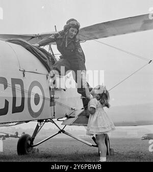 HOUSEWIFE IS PART- TIME PILOT    A housewife with a hobby that keeps her '' up in the air '' a good deal of the time is Mrs 'Jackie ' Moggridge of Taunton, Somerset, who is the West country only W.A.A.F.V.R. pilot.  Married (her husband was R.E. captain in World War II), and the mother of a three-year-old girl, Jill, Mrs Moggridge runs her home, does all the housework and sewing, takes part in amateur operatic's in Taunton, and still finds time to run up to the Filton, Gloucestershire, aerodrome once a week for an afternoon of flying.  She has flown over two thousand hours in 63 different type Stock Photo