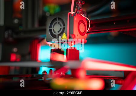 3D printer preparing object. Production prototype. Nozzle clese-up. Stock Photo
