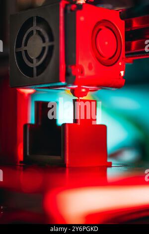3D printer preparing object. Production prototype. Nozzle clese-up vertical Stock Photo