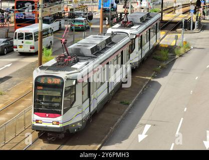 Articulated two-section light rail tram running in Yuen Long, Hong Kong Stock Photo