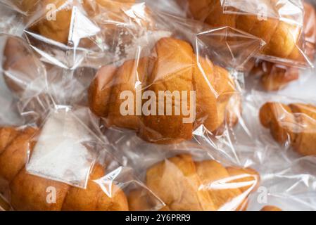 Freshly baked doughnuts packaged in transparent nylon for refreshment after a worship service in Church, Oyo, Nigeria on August 17, 2024. Stock Photo