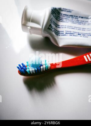 Still life of a tube of Crest, toothpaste and bristle toothbrush ready to use, 2024, United States Stock Photo