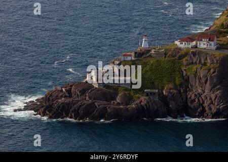 Fort Amherst on South Head, lighthouse, St. John's, Newfoundland, showing buildings and ships in the harbor in Summer Stock Photo