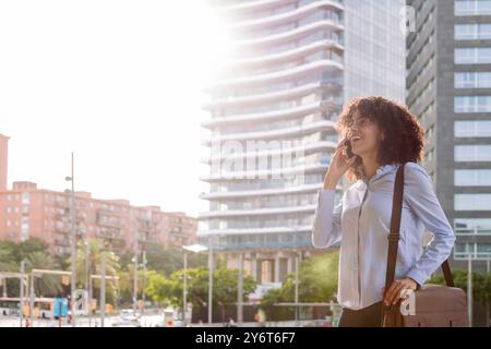 female entrepreneur talking on mobile phone Stock Photo