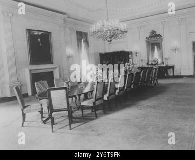 The refurbished state dining room of the White House , Washington DC , made since President Kennedy moved in .  Situated in the southwast corner of the first floor , the main changes have been in the furniture and a redeisgned fireplace - but the President has kept the portrait of Abraham Lincoln over the fireplace where it was hung when the Truman family moved back into the White House from Blair House . 15 December 1961  Comparison picture IPU426681 Stock Photo