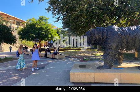 Los Angeles, USA. 26th September, 2024. University students taking photos of the Bruin Bear statue on the campus of UCLA, the University of California, Los Angeles, in Westwood, Los Angeles, California. Students returned to the college for the start of classes today. Credit: Stu Gray/Alamy Live News. Stock Photo