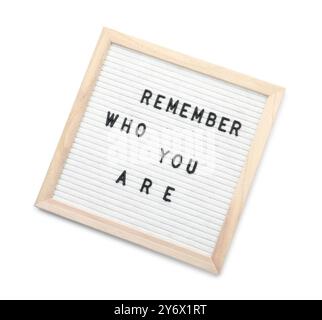 Letter board with phrase Remember who you are on white background, top view Stock Photo