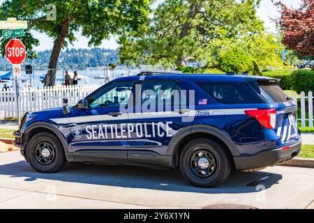 Seattle, WA, USA -July 3, 2024: Blue and white Seattle police car parked on street. Seattle state police. Stock Photo