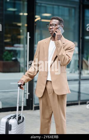 Black Man On Business Trip Talking On Phone Stock Photo