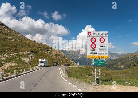 Spluegen Pass, pass road and road sign at the border between Italy and Switzerland Stock Photo