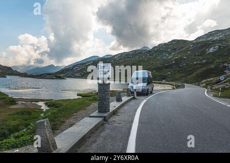 Mountain landscape with alpine lake on the top of San Bernardino Pass, pass road and Lake Laghetto Moesola, Mesocco, Canton of Grisons, Switzerland Stock Photo