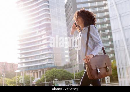 female entrepreneur talking on mobile phone Stock Photo
