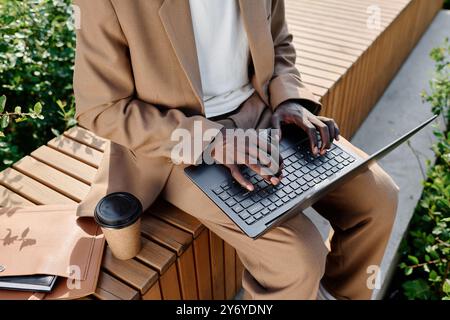 Unrecognizable Businessman Using Laptop Outdoors Stock Photo