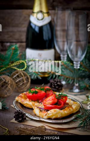 fillet of a salmon and vegetables  in puff pastry on a New Year's holiday table. selective focus Stock Photo