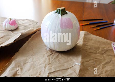 Small Pie Pumpkin Painted Trendy White and Pink for Halloween Craft Stock Photo