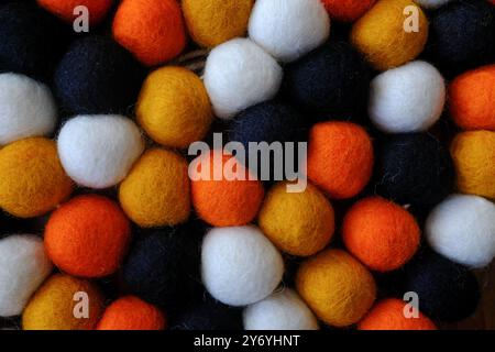 Closeup of Textured Halloween Felt Balls on String Stock Photo