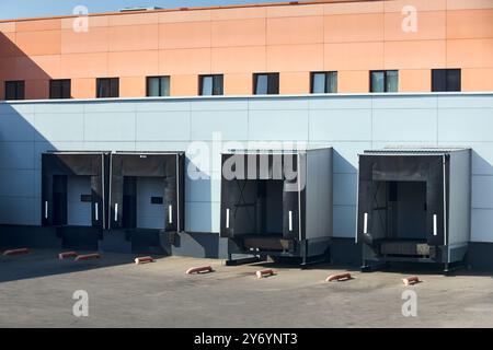 Loading dock or loading bay with bumpers, levelers, lift, dock seals or shelters, Loading bay is area of building where goods vehicles road or rail ar Stock Photo