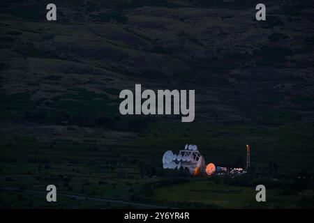 Satellite dish complex on mountains in dark Stock Photo