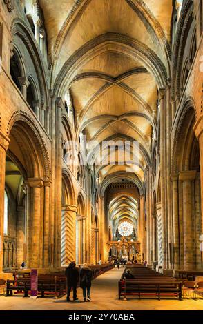 The nave and central aisle of Durham Cathedral, with its decorative cylindrical stone pillars. 6.6 metres high.  Durham, England, UK. Stock Photo