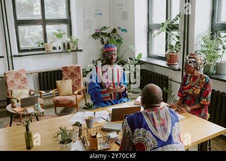 African American coworkers having meeting with their teamlead in private office Stock Photo