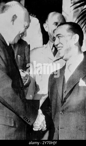 United States President Eisenhower ( left ) shakes hand with President Kubitschek of Brazil ( right ) at Key West , Florida , USA . President Kubitschek , who takes office on 31 January 1956 , has commenced a tour of the United States and Europe . Also in the picture ( centre background ) is General Alfred Guenther .  5 January 1956 Stock Photo