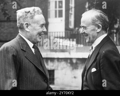 MINISTERIAL MIRTH    Mr . JOSEPH CHIFLEY ( left ) , the Australian Prime Minister , and Sir STAFFORD CRIPPS , Britain's Chancellor of the Exchequer , share a joke in the garden of No . 10 Downing Street , London , when Mr Clement Attlee , the British Prime Minister , and Mrs . Attlee entertained Commonwealth statesmen gathered in London for the Commonwealth Conference .  During his stay in London , Mr . Chifley is expected to discuss with Sir Stafford and other British Ministers , the plan to develop Australia's Northern Territory as a beef - raising area .     21 April 1949 Stock Photo