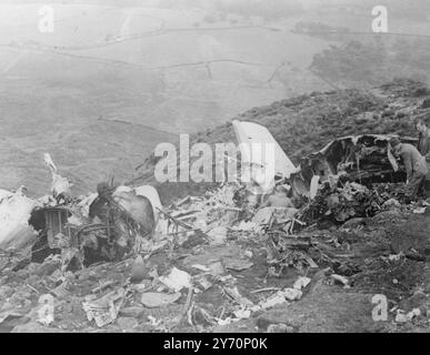 23 DEAD IN AIRLINER CRASH    Twenty three of the thirty two occupants lost their lives today when a British European air ways Dakota flying from Belfast to Ringway, Manchester, crashed on a lonely hillside at Kindersintake, Greenfield, near Oldham, Lancashire.  Twenty two were killed outright and one died in hospital.  The plane carried 16 women, 7 men, 3 children over 2 years, 3 babies and the crew of three .  The Dakota, which had passed over Ringway Airport, Manchester, hit 1200 ft . Kindersintake, known locally as Wimberryhill.  R.A.F. mountain rescue men from Harpur Hill, near Buxton, rac Stock Photo