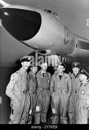 From London non-stop in 20 hours. SYDNEY;   The crew of an RAF Vulcan jet bomber are seen beside their aircraft after a 20 hour, 12,000 mile non-stop flight from Britain today.  Left to right ; F/Lt G Jukes, Co-pilot F/Lt. David Bromley, Chief Technician William McAlpine, the Captain, Squadron leader Michael Gordon Beavis, Navigator, F/Lt. Clive Taylor and Electronics Officer F/O John Knight.  The longest non-stop flight by a Vulcan bomber ended when the aircraft touched down at Richmond Royal Australian Air Force Base near here.  The jet took off from Scampton, Lincolnshire, yesterday (20th) Stock Photo