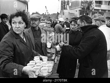 Members of the Salvation Army hand out welcome cups of tea to rescue workers at the scene of today's partial collapse of a recently completed 23 storey block of flats at Customs House , East London . The collapse occurred at 6 o'clock this morning . One eye witness said there appeared to have been an explosion . The latest casualty figures are three dead , nin injured and seven , including three married couples , unaccounted for . Rescue operations were later because of the dangerous situation in which the men were working in . - - The tower block is also known as Ronan Point , named after Dep Stock Photo