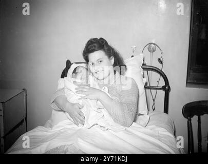 When Mrs. MAUD PHILIPP, of West Ham , London , gave birth to a girl in Plaistow Maternity Hospital within a few minuets of the arrival of Britain's new prince, she touched the hearts of Americans . They heard that Elizabeth as the child was named , was not born with a silver spoon in her mouth and that Mrs. Philipp and her bus conductor husband lived in a Nissen hut in the ruins of London's dockland .  Here is part of the result of the American's sympathy . Shops, firms, and private people of New York have promised to send Elizabeth a bedroom suite- complete with cot (£250) chest of drawers , Stock Photo