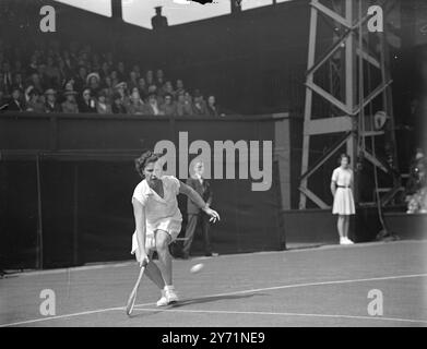 THE WIGHTMAN CUP AT WIMBLEDON .    Play in the Wightman Cup match between the women of Great Britain and of the U S A , began at Wimbledon .     PICTURE SHOWS :-  Mrs W du PONT ( USA)  gets down to a low shot  during her match against Mrs . BOSTOCK  (Britain) . Mrs du PONT won the match .     June 11 1948 Stock Photo