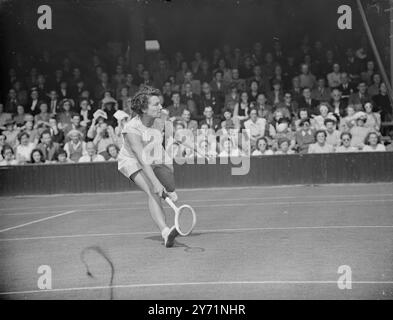 THE WIGHTMAN CUP AT WIMBLEDON .    Play in the Wightman Cup match between the women of Great Britain and of the U S A , began at Wimbledon .     PICTURE SHOWS :-  Miss . BETT HILTON ,   ( Gt . Britain ) in play against Miss . BROUGH ( USA) . at Wimbledon .     June 11 1948 Stock Photo