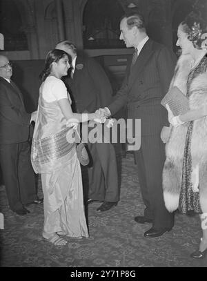 'Anglo-Indian Friendship' - Lord Louis Mountbatten at East India Reception Recently returned from his post as the last British Governor-general of India, Earl Mountbatten, with Countess Mountbatten, attended a reception given by the East India Association, in Kensington, London.     Picture shows: 'Young India'   Miss Chari, daughter of Sir, V.T Krishnamachari, Prime Minister of Jaipur, shakes hands with Earl Mountbatten, as Countess Mounbatten looks on, at today's reception.   29 June 1948 Stock Photo