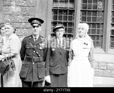 St John's Investiture   Members of the St John Ambulance Brigade from all over the country attended an investiture at St John's Gate, Clerkenwell, headquarters of the Brigade.     Picture shows : (Left to right) - Mr William Edwin Nicholas Searle, of Bedminster (Officer Brother); Miss Katherine Eunice Short, of Bristol (Serving Sister); and Miss Elinor Maud Tarr, of Bristol (Serving Sister), photographed at the Investiture today.     30 July 1948    30 July 1948 Stock Photo