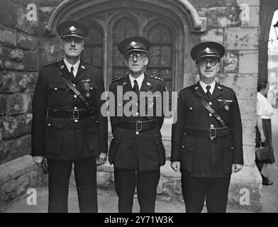 St John's Investiture   Members of the St John Ambulance Brigade from all over the country attended an investiture at St John's Gate, Clerkenwell, headquarters of the Brigade.     Picture shows : (Left to right) - Mr Eric Edwards, M.B.E; Mr Thomas Penn; and Mr Edmund Capstick, all of Hull (Serving Brothers), photographed at the Investiture today.    30 July 1948 Stock Photo