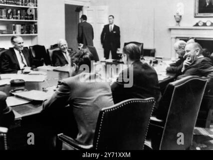 Vietnam Discussion    Washington DC : President Johnson (right) meets with top Government officials in discussions of the Vietnam situation here yesterday. Facing camera on far side of the table are US ambassador to South Vietnam Maxwell Taylor (left) and Central Intelligence Agency director John McCone. Left to right in foreground are, Cyrus Vance, Under-secretary of Defence, Defence Secretary Robert McNamara, The President and Secretary of State Dean Rusk. 2 April 1965 Stock Photo