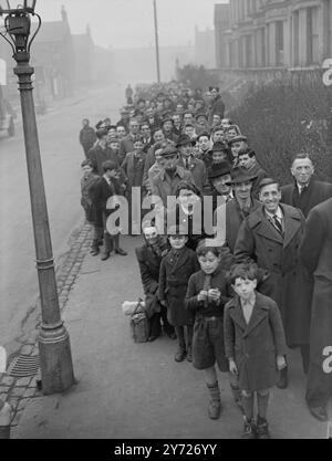 Queue Park Rangers. - - - - Part of the queue which formed outside the ground of Queen's Park Rangers at Loftus Road, Shepherds Bush, this afternoon for tickets for the F.A Cup Sixth Round replay between the Third Division side and Derby County at Derby next Saturday. Everyone in the queue is determined to do his share in cheering the side on to become the first Third Division side ever to reach the final of the coveted Cup. - - - - 2 March 1948 Stock Photo