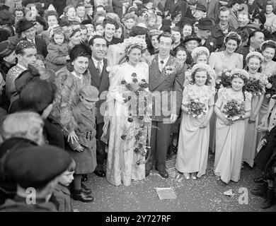 "Marry-Go-Round"   Fairground folk from all over England gathered at St James's Church, Bermondsey, today (Monday) at the wedding of 28-year-old Emily Rawlins, who runs a skittle alley, and George Lorenzo Crick, 29, who operates a spinning wheel. The couple will live in a new three roomed caravan.      March 1st 1948 Stock Photo
