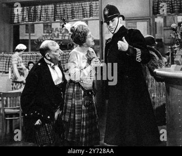 Jack's the Boy Jack Hulbert and Cicely Courtneidge in a new comedy at the Tivoli - a scene from Jack's the Boy .  In a new Gainsborough film , Jack's the Boy , direcredby Walter Forde, Jack Hulbert is seen as a police constable and Cecily Courtneidge as a cafe proprietoriess.  .  Mr Benfield is the third figure in the photograph  2 July 1932 Stock Photo