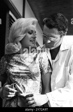 Marcello Mastroianni with actress Virna Lisi in the film La Volta Buona ( A Good Time ) 30 August 1965 Stock Photo