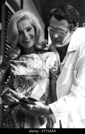 Marcello Mastroianni with actress Virna Lisi in the film La Volta Buona ( A Good Time ) 30 August 1965 Stock Photo