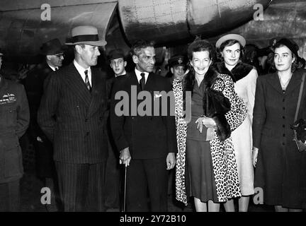 Earl and Countess Mountbatten here for Royal Wedding. Earl Mountbatten, Governor General of the Dominion of India, arrived at Northolt Airport from India today (Tuesday) with Countess Mountbatten and their younger daughter, the Hon Pamela Mountbatten, who is to be one of Princess Elizabeth's eight bridesmaids. There to meet them were the son-in-law and daughter of Earl and Countess Mountbatten, Lord and Lady Brabourne. Mr V K Krishna Menon, High Commissioner for India in London was also there to greet them.  Picture shows, left to right, Earl Mountbatten, Lord Brabourne (in background), Mr Kri Stock Photo