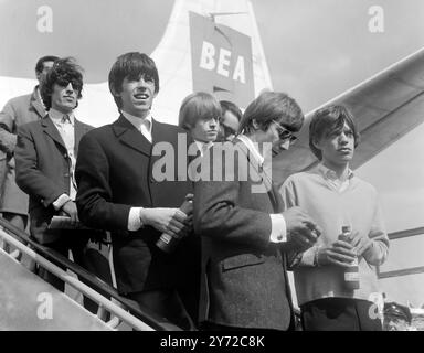 The Rolling Stones. Portrait of the English rock group, The Rolling Stones, arriving at Schiphol Airport in 1964. From left to right, Bill Wyman, Keith Richards, Brian Jones, Charlie Watts and Mick Jagger Stock Photo