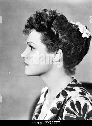 Linden Travers as 'Ilona' in 'beware of pity' her hair dressing is of the 1914 period i which the film is set, but the style is fashionable again today, with its suggestion of Greek sculpture and the flower ornament.  7 February 1946 Stock Photo