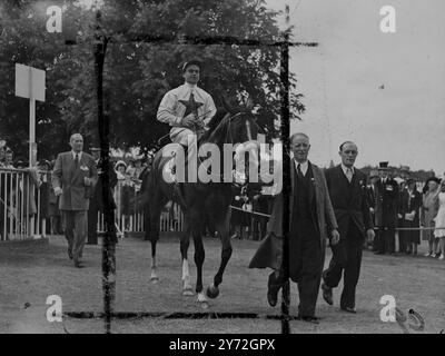 Europe's richest race, the Gold Cup, was won at Ascot by Mons. F.R. Schmitt's Souverain, ridden by French jockey M. Lollierou.  Odds on favourite Chanteur II, also French bred but now British owned, was beaten into second place, with the Aga Khan's Field Day third. The race was run in the presence of the King and Queen, Princess Elizabeth and other members of the Royal family. Picture shows:Souverain is led in after winning the Gold Cup.  19 June 1947 Stock Photo