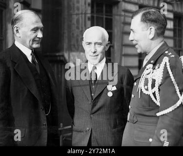 45 British military officers and civilians who 'materially aided the Allied cause' during the war and he served jointly with the US government or agencies in the United States and abroad, were decorated by Major General Clayton L Bissell at the American ambassador's residence in Princes gate, London, today, Thursday. Picture shows: Sir Robert Sinclair (centre), chairman of the Imperial tobacco company, wartime chief executive at the Ministry of production, and now industrial consultant to Britain's master planner, Sir Edwin Plowden, pictured with Mr Lewis Douglas, the US ambassador (left) and Stock Photo