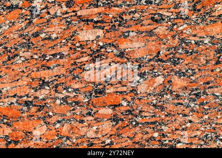 texture of natural polished dark red granite background close-up Stock Photo