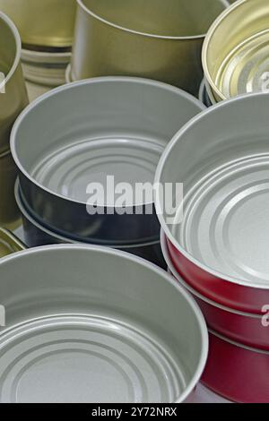 Big group of assorted empty clean preserve tin cans. Close up shot, abstract food industry background. Stock Photo