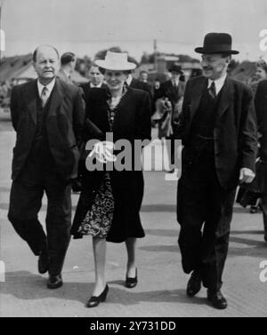 Mr Attlee leaves for Peace Conference. The Prime Minister, the Rt Hon C R Attlee, MP, left by air this afternoon (Sunday) for Paris, where he will deputise for the Foreign Secretary at the Peace Conference, which opens tomorrow at the Luxembourh Palace. He was accompanied by Mr Hector McNeil, Parliamentary Undersecretary of State for Foreign Affairs, and Mr Glenvil H Hall, Financial Secretary to the Treasury. The Rt Hon A V Alexander, First Lord of the Admiralty, left by air for Paris earlier today.  Photo shows, Mrs Attlee went to London Airport to see her husband off.  Here they are seen wal Stock Photo